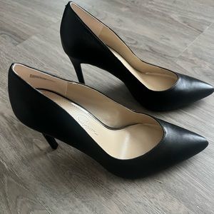 Black leather pumps